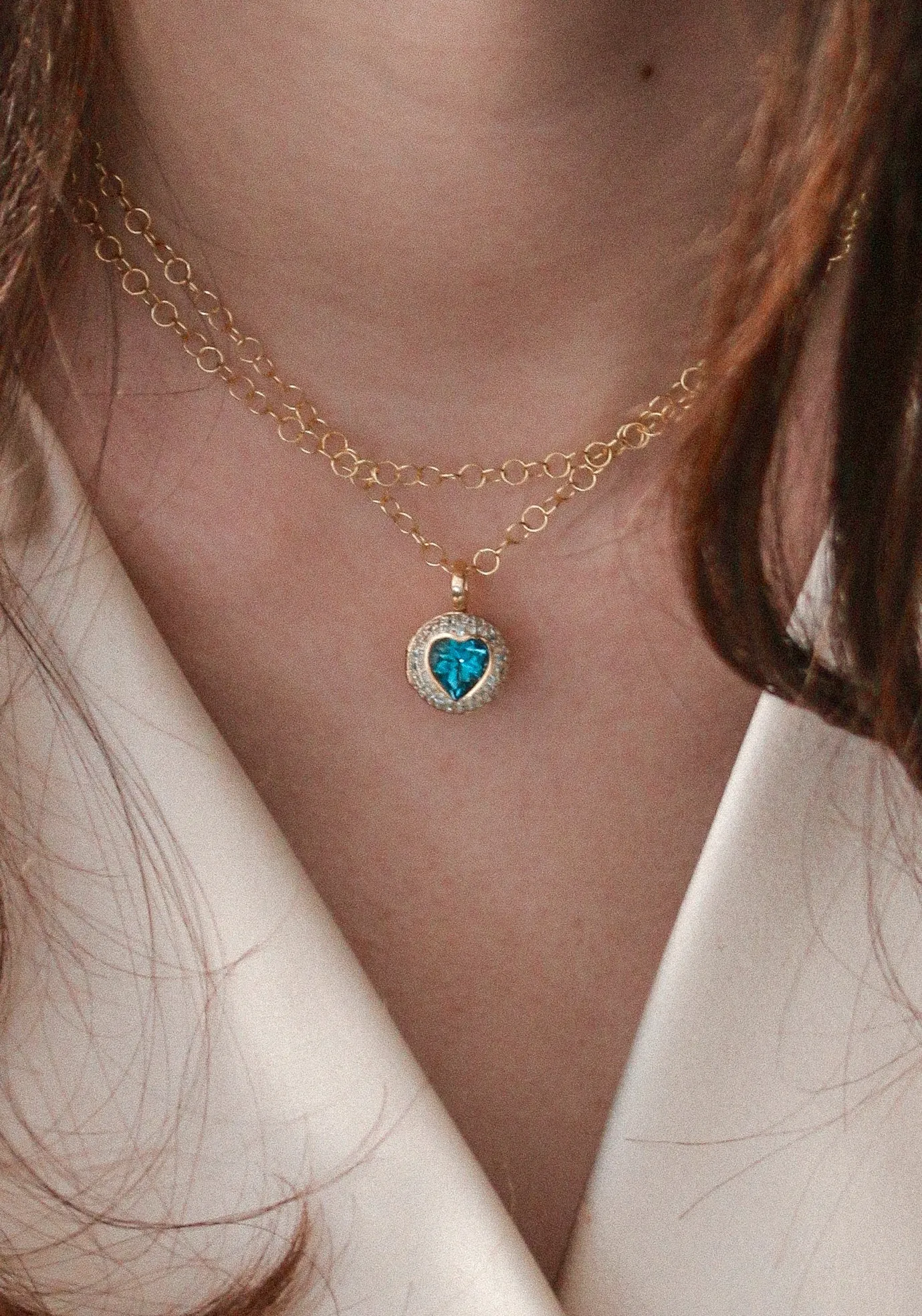 18KY Blue Topaz "Peekaboo" Heart Locket