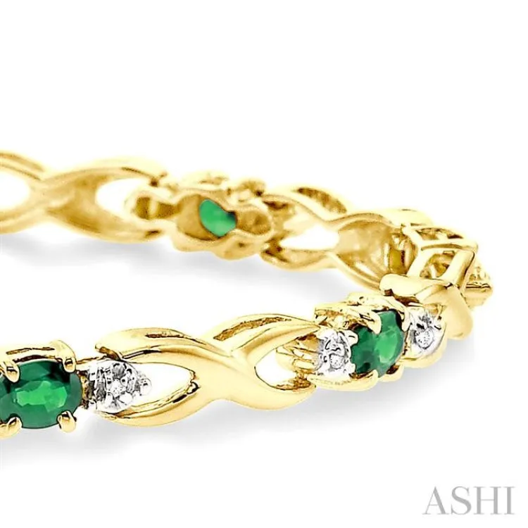 4x3 MM Oval Cut Emerald and 1/10 Ctw Single Cut Diamond Bracelet in 10K Yellow Gold