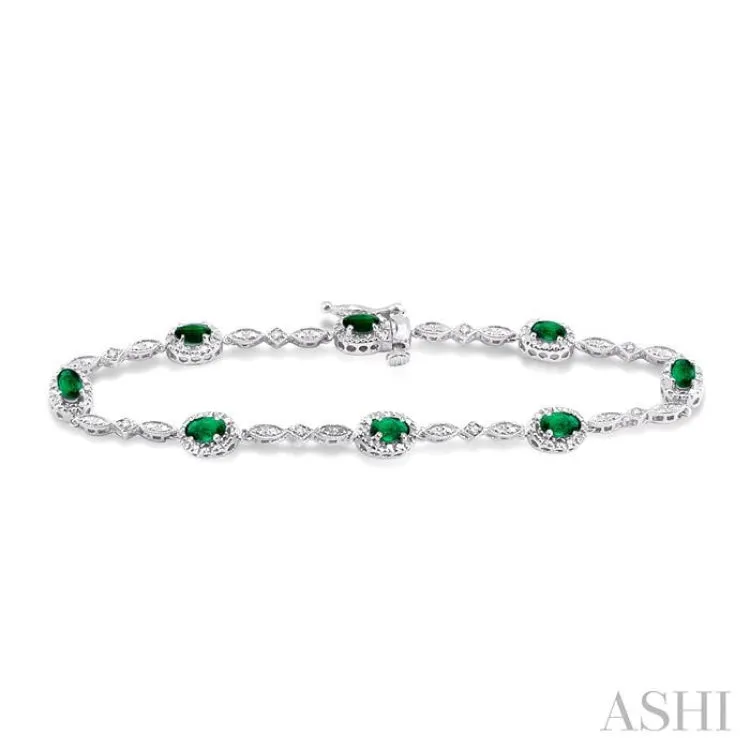 5x3MM Oval Cut Emerald and 1/20 Ctw Single Cut Diamond Bracelet in 14K White Gold