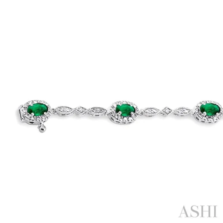 5x3MM Oval Cut Emerald and 1/20 Ctw Single Cut Diamond Bracelet in 14K White Gold