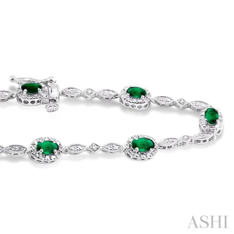 5x3MM Oval Cut Emerald and 1/20 Ctw Single Cut Diamond Bracelet in 14K White Gold