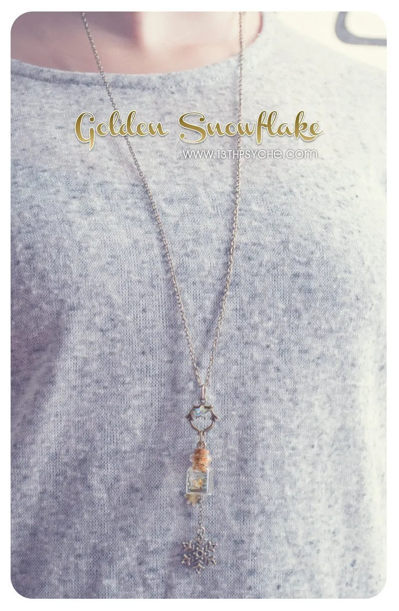 Golden snowflake glass bottle pendant necklace