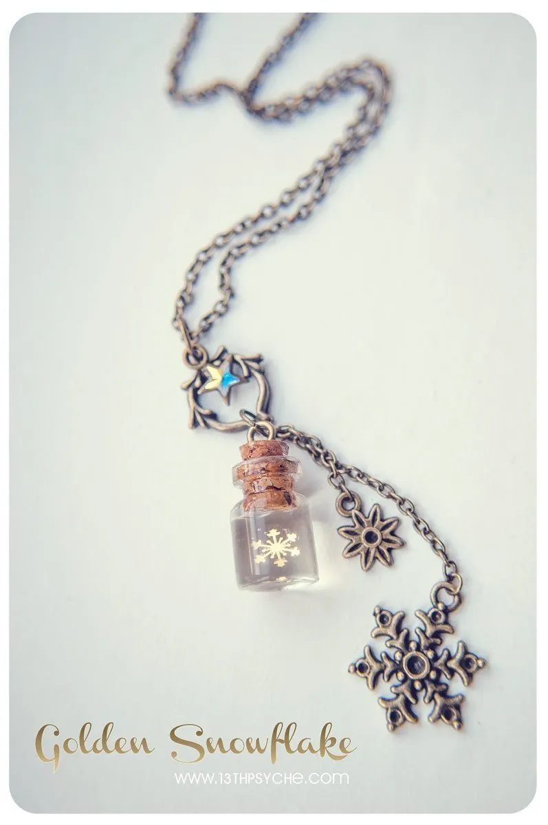 Golden snowflake glass bottle pendant necklace