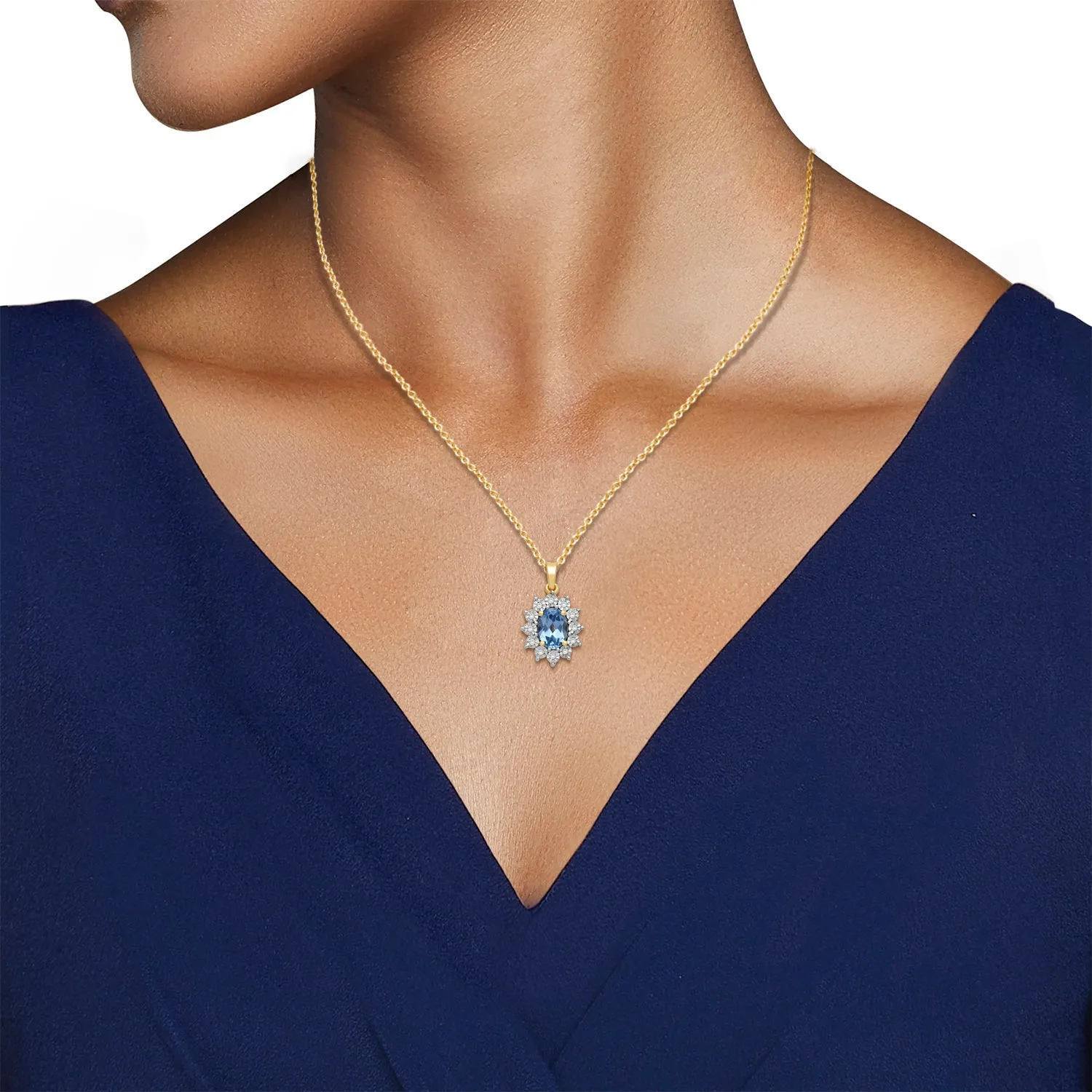 Jewelili 18K Yellow Gold over Sterling Silver 7x5 MM Oval Genuine Swiss Blue Topaz and 1/20 Cttw Natural White Round Diamond Pendant Necklace